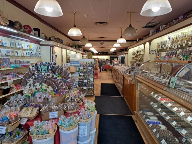 Candy displays and chocolate counters inside the Nutty Chocolatier Beaches shop