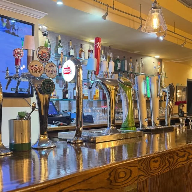 Beer taps along the bar at Outrigger