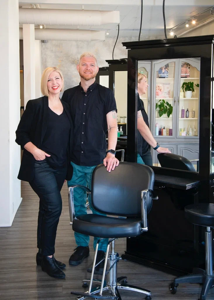 Two members of The Cabinet team inside the salon.