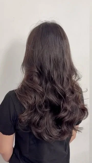 Long dark waves shared by HairTree stylist Grace.