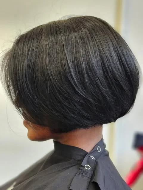 Dark chin-length bob with a fringe from H&CO’s portfolio.