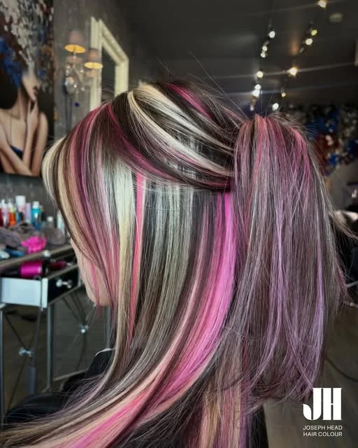 Pink, blonde and brown colour sections in hair shown by Joseph Head Hair Colour.