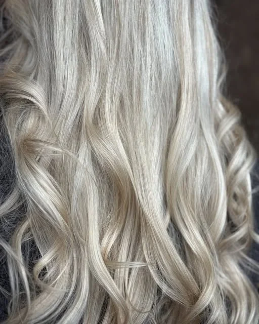 Long silver-toned waves from Joseph Head Hair Colour.