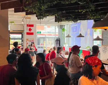 A mixed crowd watching soccer inside Steadfast Brewing Co. in Toronto