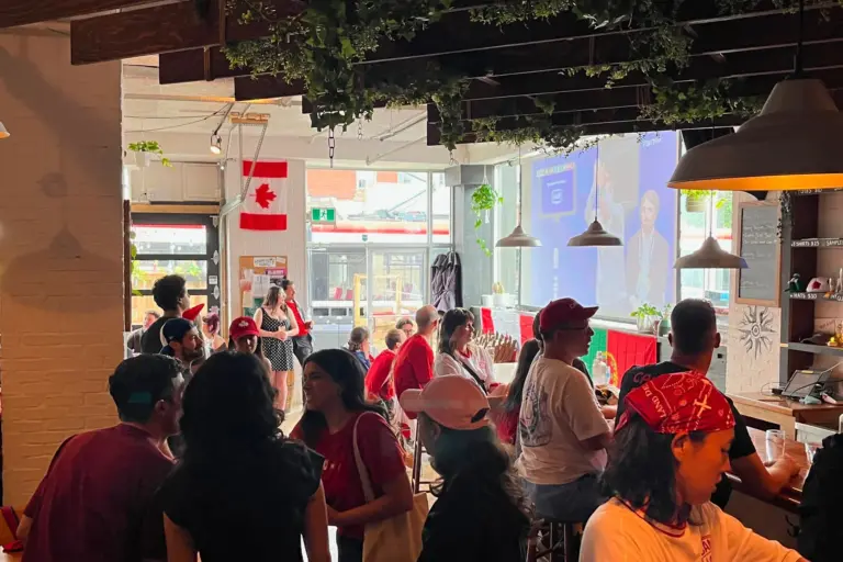 A mixed crowd watching soccer inside Steadfast Brewing Co. in Toronto