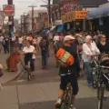 People walking through a car-free Kensington Market street in Toronto