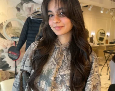 A long layered hairstyle with a fringe, shown in N15’s portfolio.