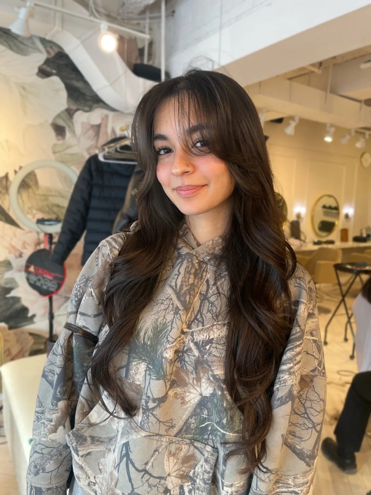 A long layered hairstyle with a fringe, shown in N15’s portfolio.