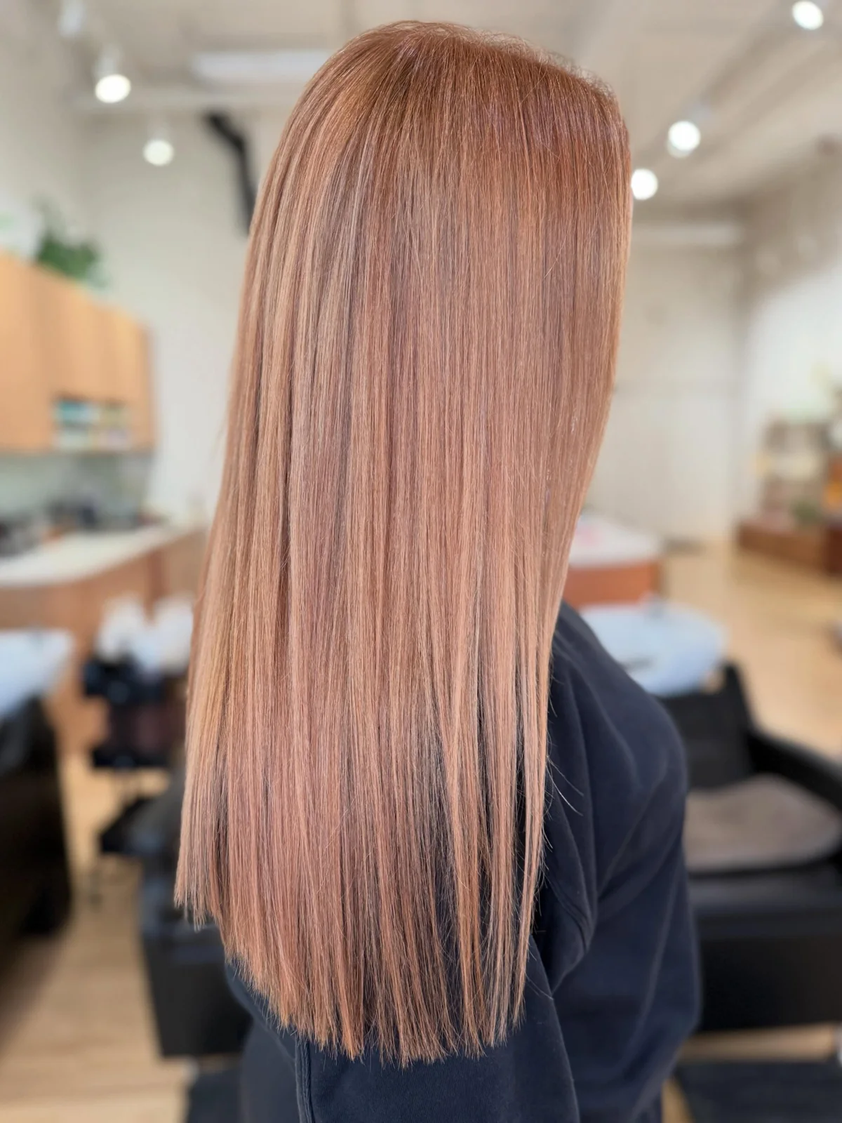 Straight copper-coloured hair shown from behind.