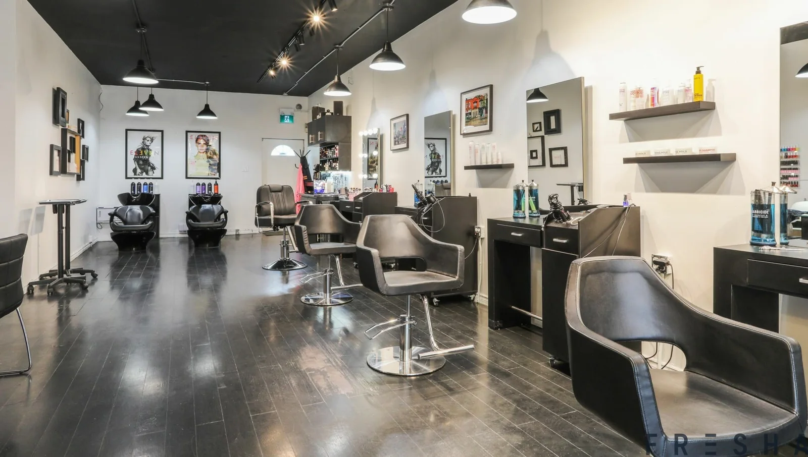 Styling chairs and mirrors inside Emerald Hair & Beauty.