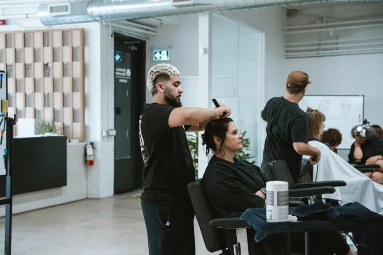 Haircutting instruction in the Glassbox Education salon.