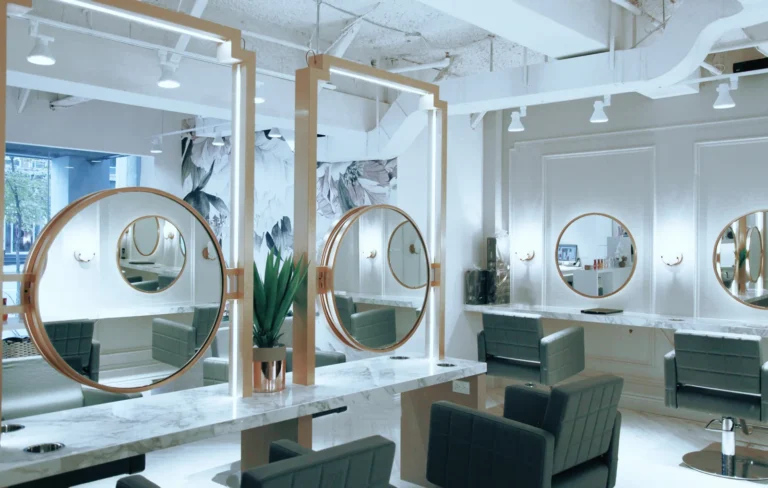 Round mirrors, black chairs and bright white walls inside N15.