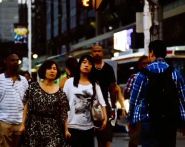 Large crowd crossing at Yonge and Dundas in downtown Toronto