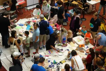Families and adults making crafts together at Toronto Reference Library