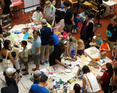 Families and adults making crafts together at Toronto Reference Library