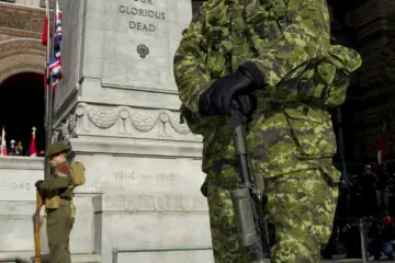 People gathered at Toronto's Old City Hall Cenotaph for Remembrance Day