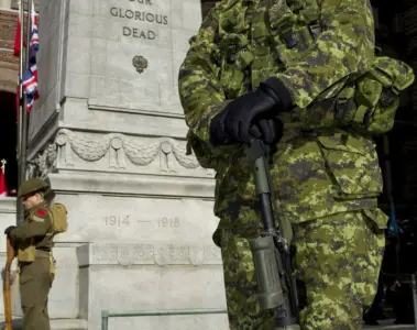 People gathered at Toronto's Old City Hall Cenotaph for Remembrance Day