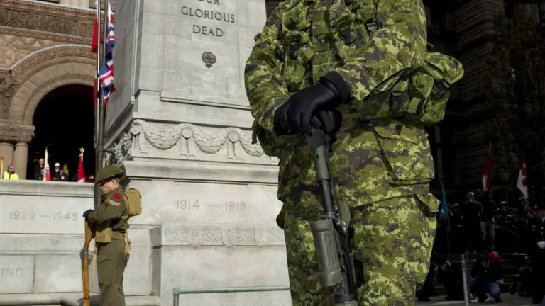 People gathered at Toronto's Old City Hall Cenotaph for Remembrance Day