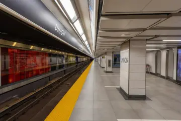 Passengers waiting on a modern TTC subway station platform