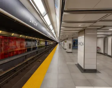 Passengers waiting on a modern TTC subway station platform