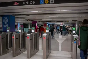 PRESTO card readers on fare gates inside a Toronto subway station