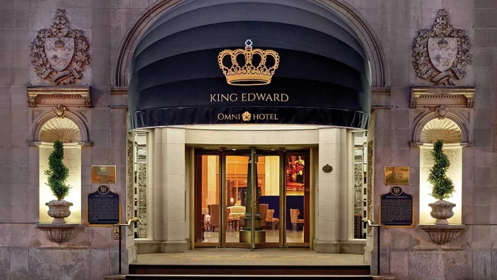 The King Edward Hotel entrance under a black canopy with a gold crown