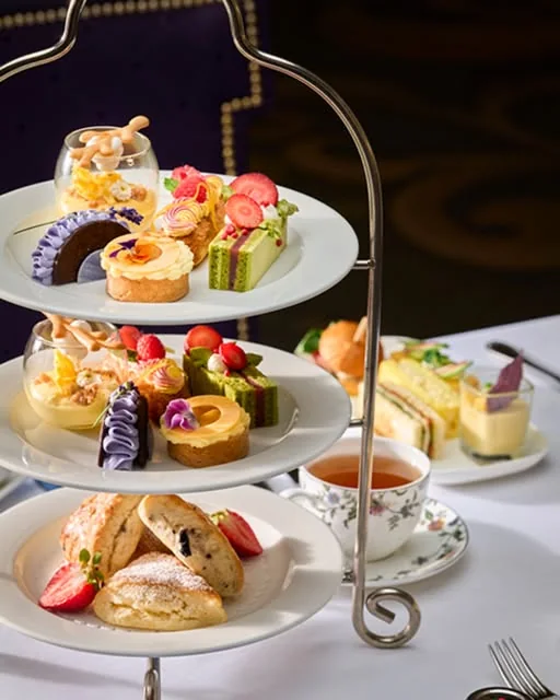 Scones and colourful pastries on a tiered tea stand at the King Edward Hotel