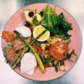 Eggs Benedict with potatoes and greens at ViVetha Bistro