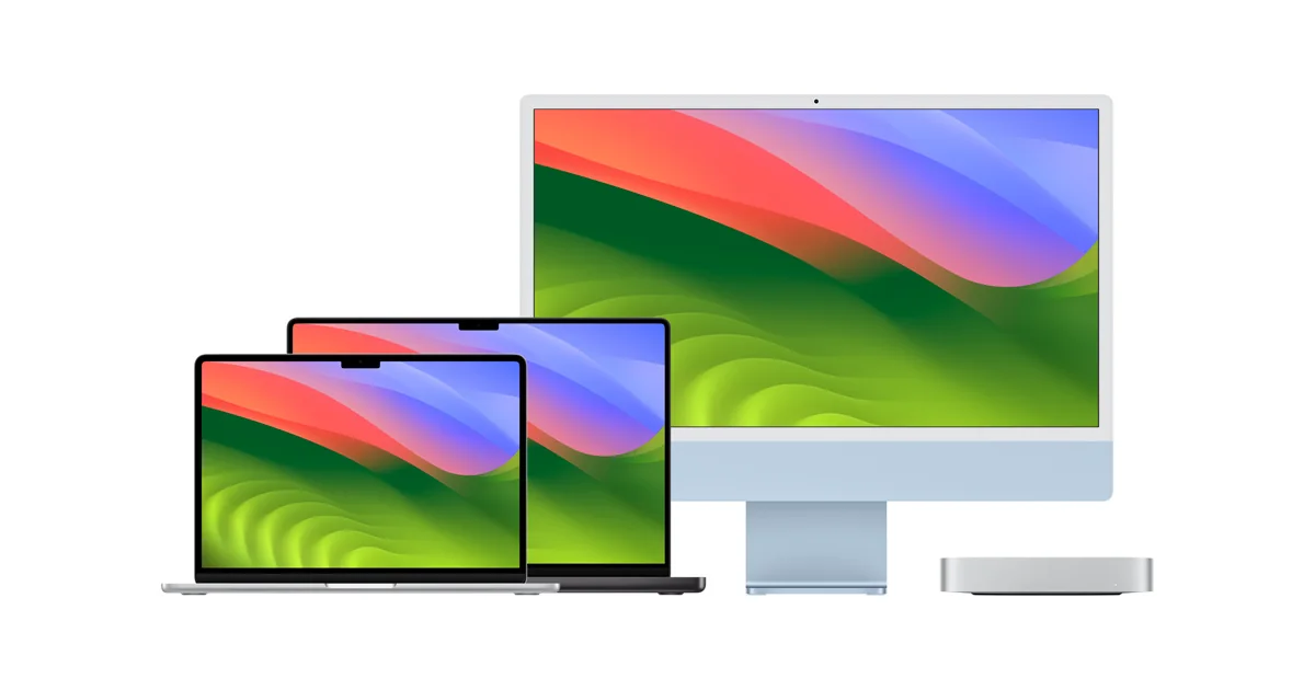Apple laptops and a desktop computer on a white background