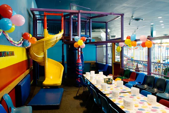 A party room with an indoor play structure at Fantasy Fair