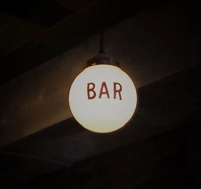A hanging bar sign at Three Speed