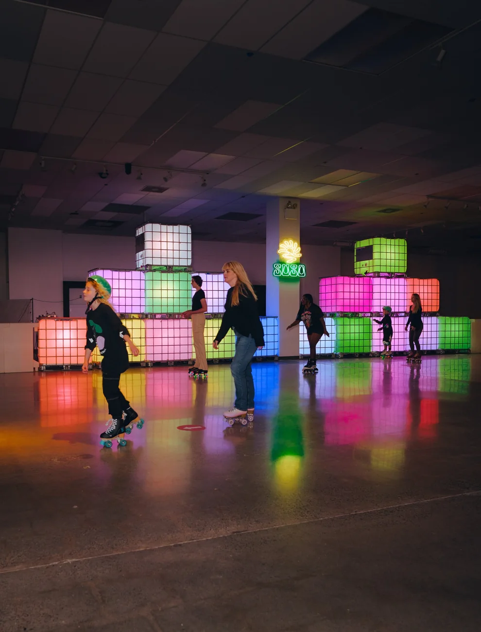 People skating at a SUSO pop-up roller rink