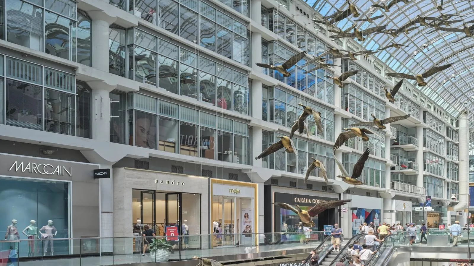 The glass-roofed shopping hall inside CF Toronto Eaton Centre