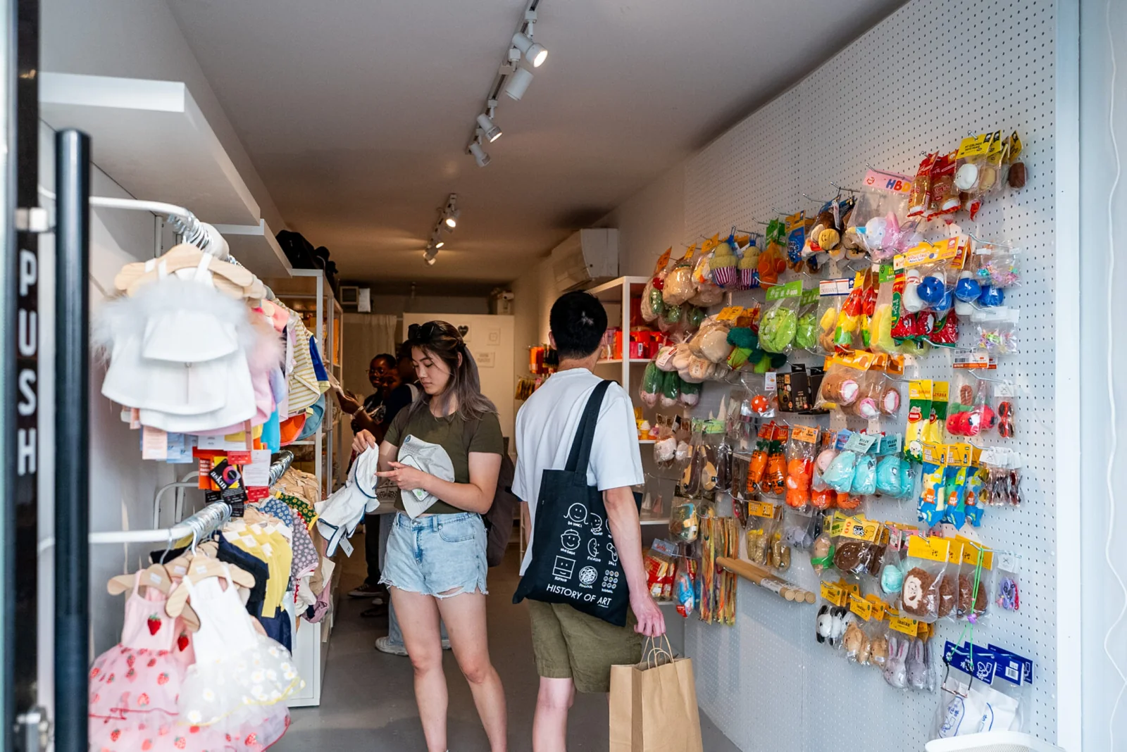 Shoppers inside a small retail space at STACKT Market