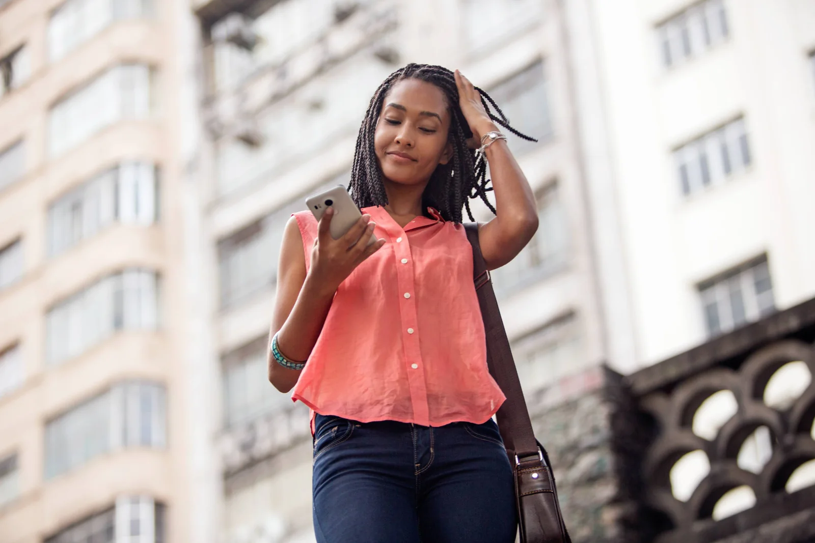 A woman checking her phone in an Uber rider photograph