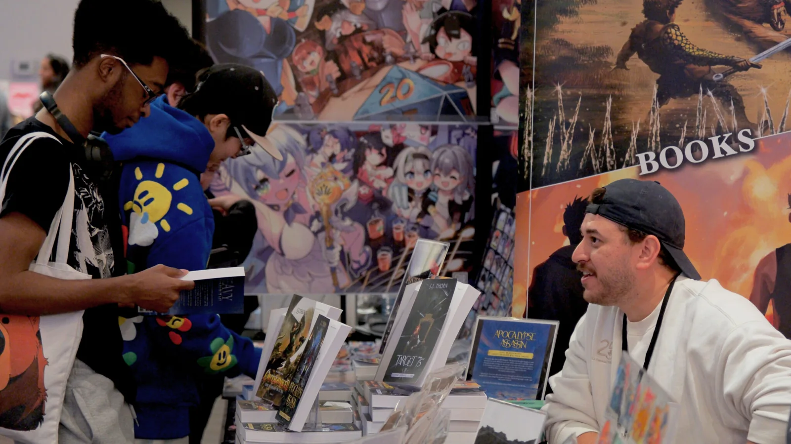 Visitor speaking with an exhibitor at a VGLX gaming event