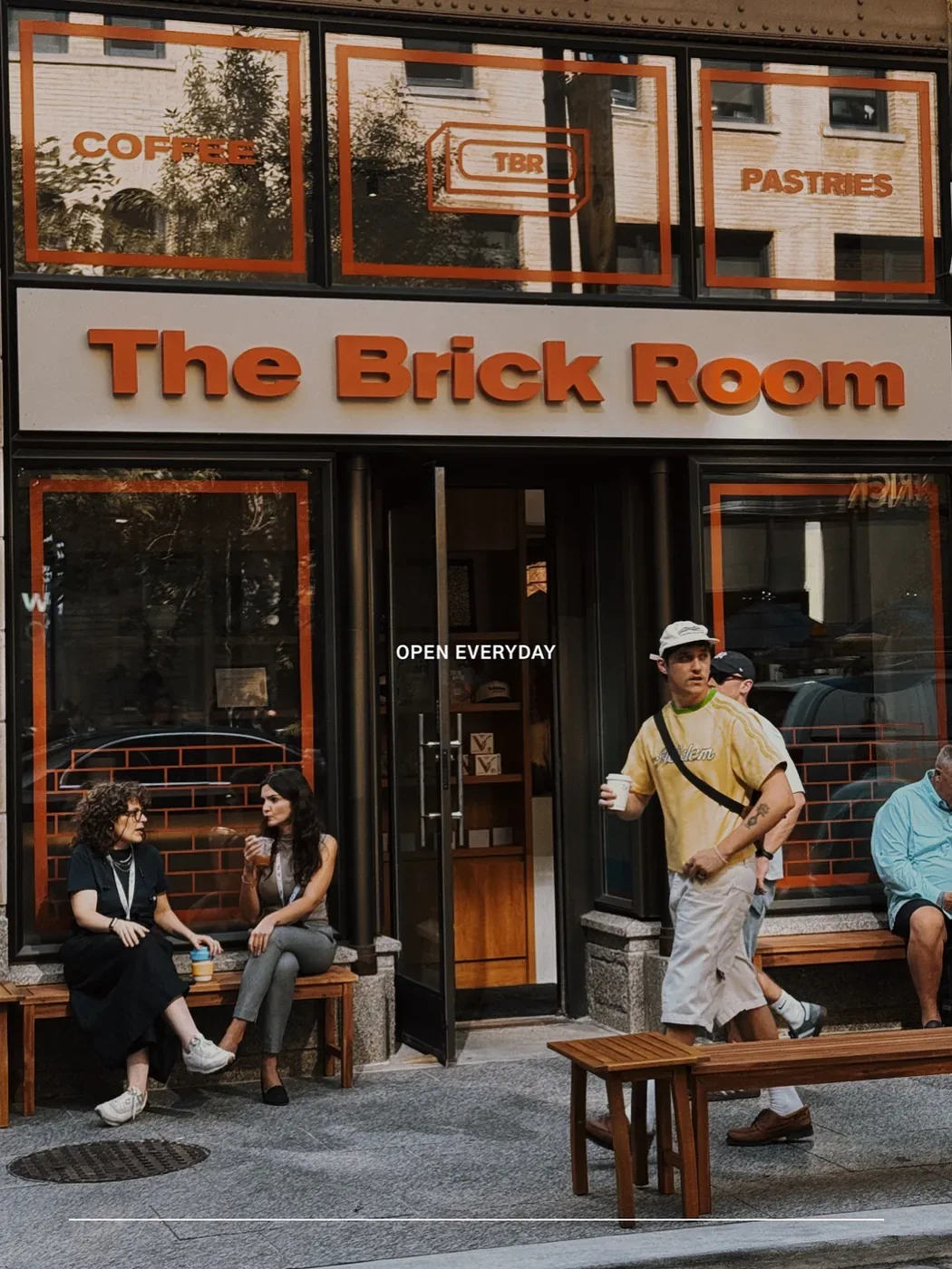 People outside The Brick Room storefront on Temperance Street