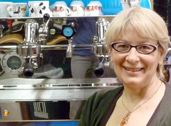 A woman beside the espresso machine at Everyday Gourmet in St Lawrence Market