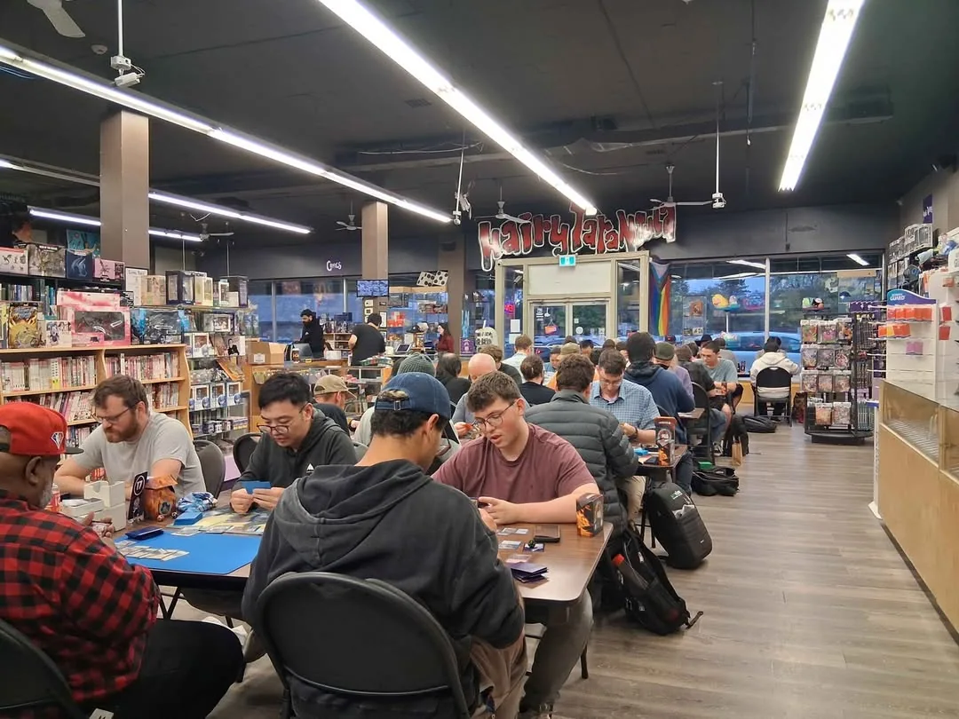 People playing Magic: The Gathering at tables inside Hairy Tarantula