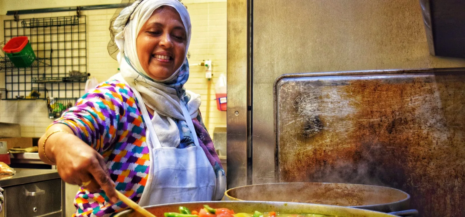 Woman preparing food in a Fred Victor kitchen