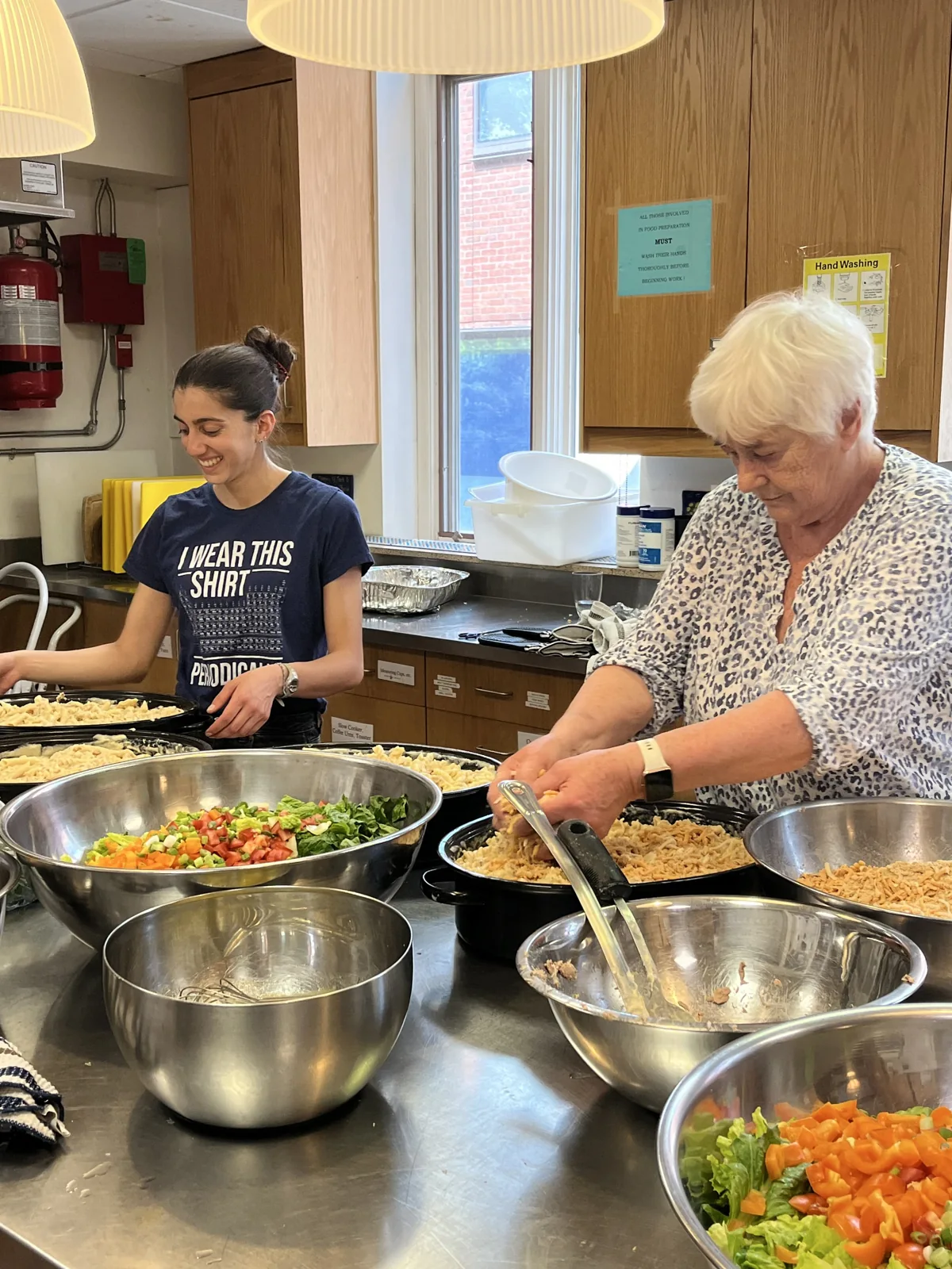 St. Thomas’s volunteers preparing salad in the kitchen