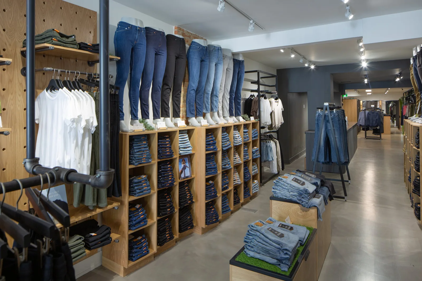 Jeans and clothing displayed inside DUER’s Toronto store