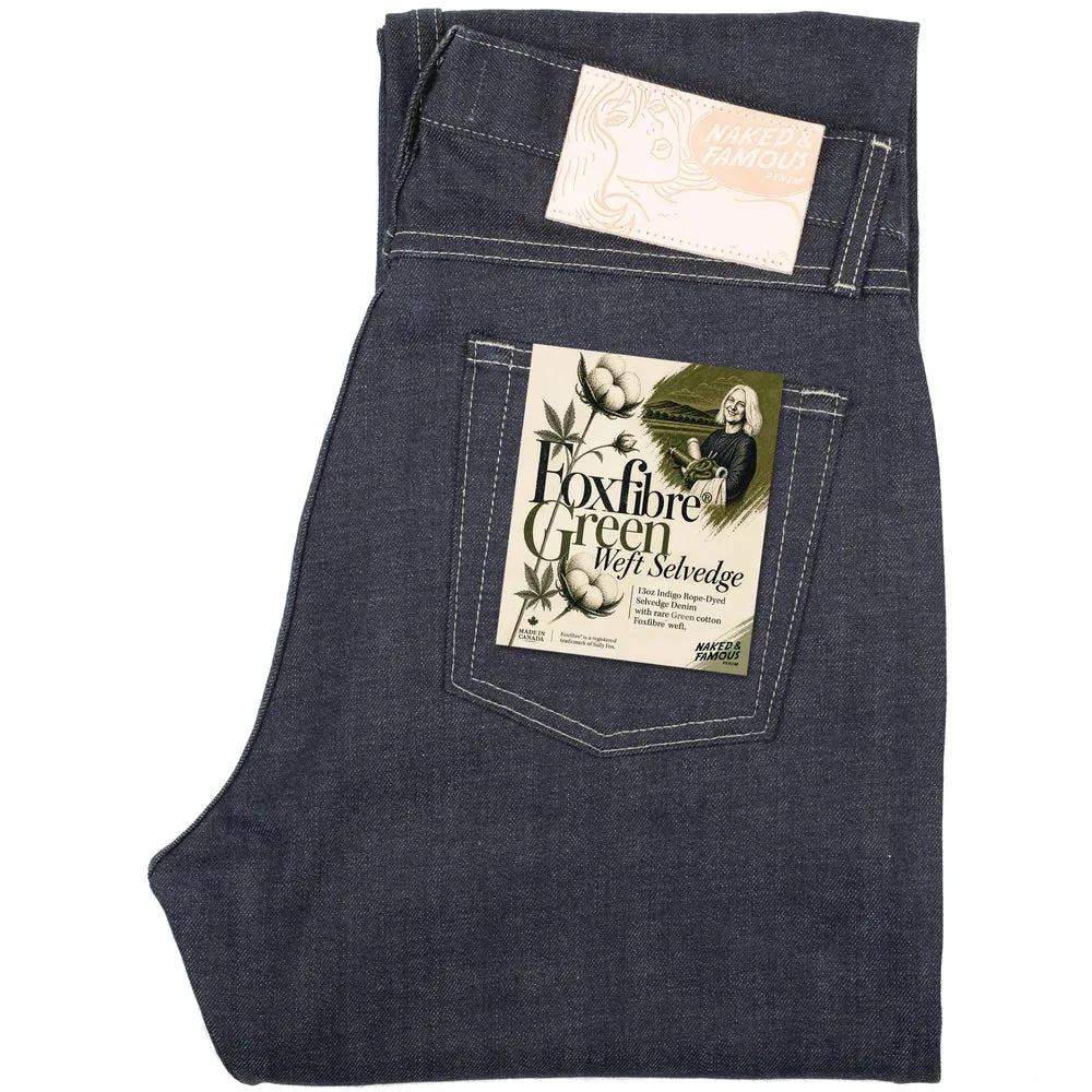 Folded dark denim jeans showing the back pocket and fabric label