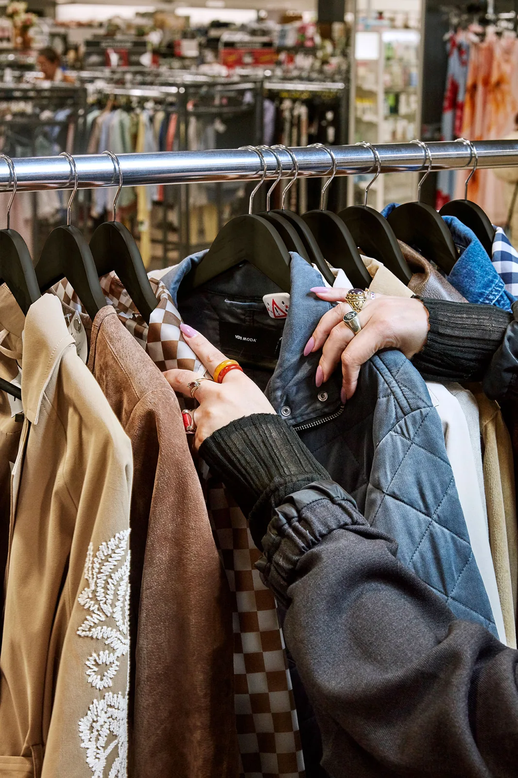 Jackets hanging closely together on a clothing rack