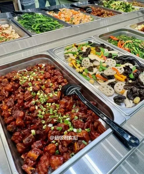 Prepared dishes arranged in metal trays at the new T&T hot-food counter