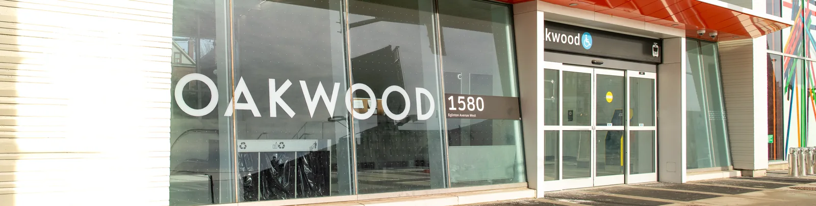 Glass doors and station lettering at the Oakwood Station entrance