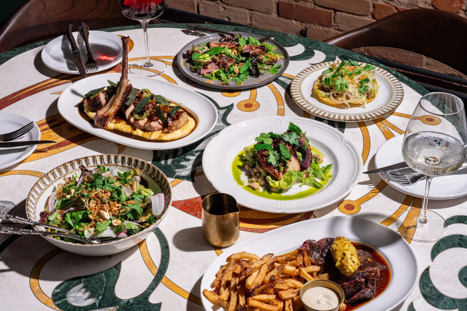 Food and the dining setting in The Berczy Tavern's official photo