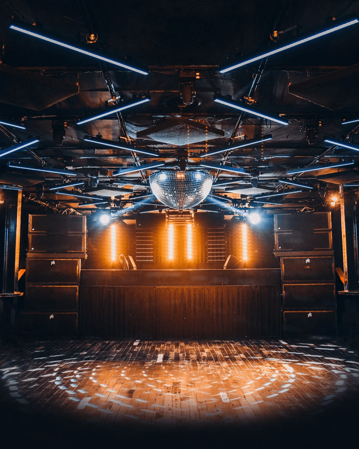 An empty dance floor and overhead lighting inside CODA
