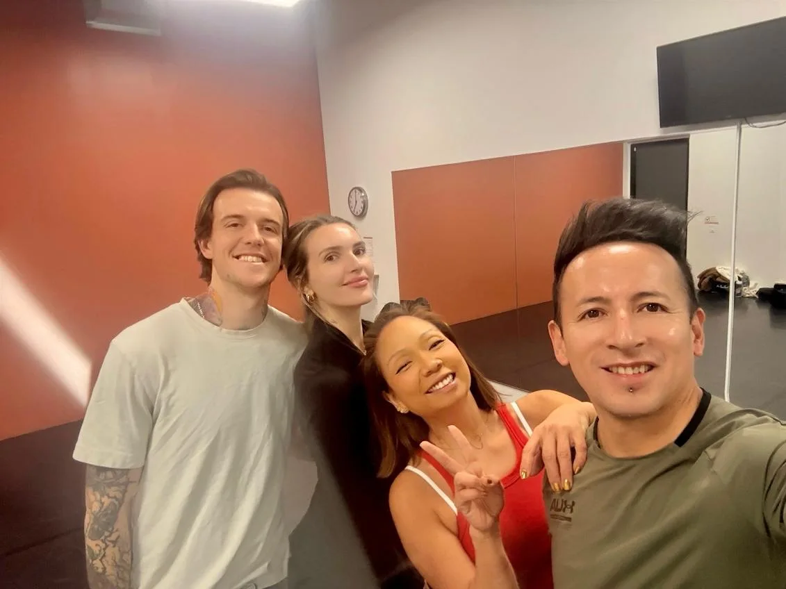 Dancers in a private-lesson photograph shared by Baila Boogaloo
