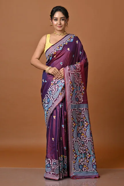 The purple saree listed by She Next Fashion. The pictured blouse style is not a coverage requirement